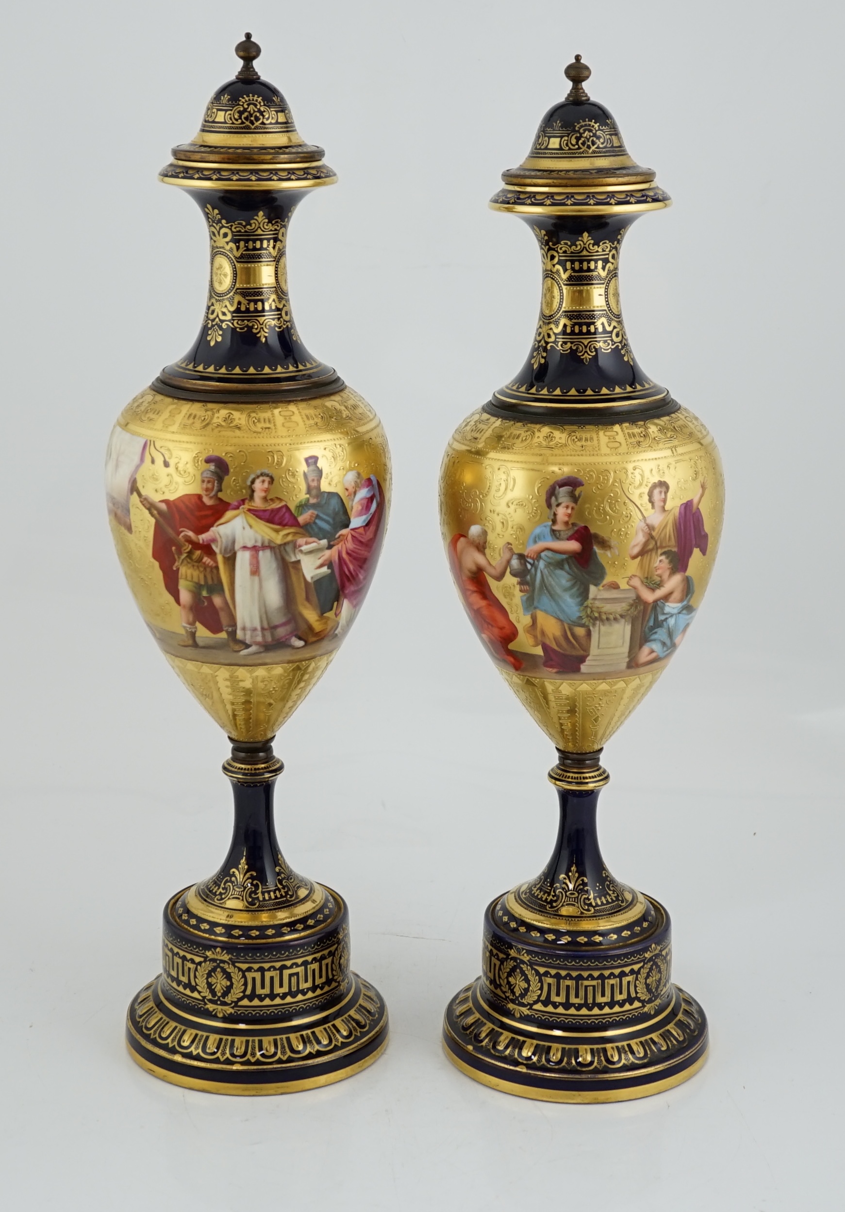 A pair of tall Vienna style porcelain vases and covers, early 20th century